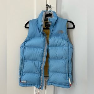 North Face puffer vest blue with yellow lining. Small S women’s. Puffy